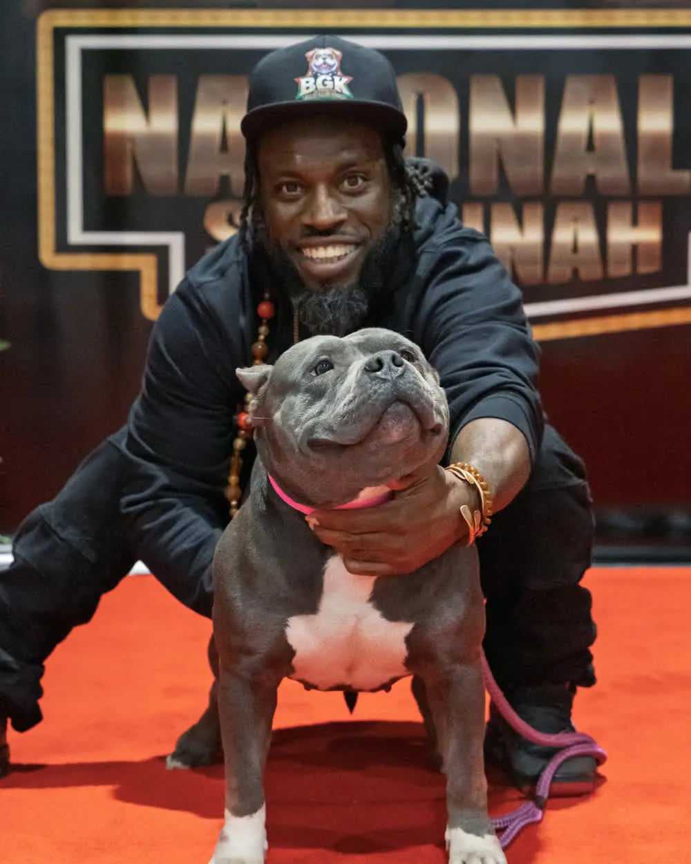 The founder of Bullies Galore Kennels with one of the kennel's American Bullies at a National show in Savannah